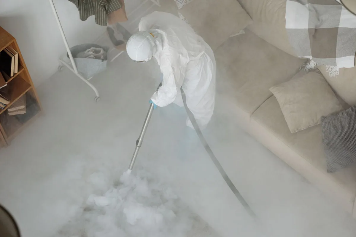 Biohazard cleanup technician in protective equipment, Aurora, TX